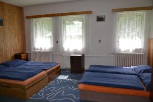 Posteľ alebo postele v izbe v ubytovaní Hostel Fortuna