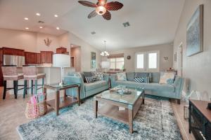 a living room with a couch and a table at Villa Holiday Sunrise in Cape Coral