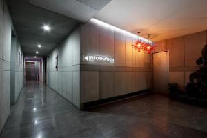 a hallway of an office with a sign on the wall at Hotel Q Chuncheon in Chuncheon