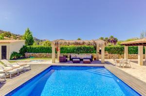 a swimming pool in a backyard with a gazebo at Villa Ponent by Sealand Villas in Pollença