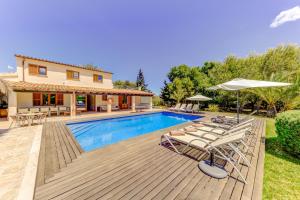 a villa with a swimming pool and a house at Villa Ponent by Sealand Villas in Pollença