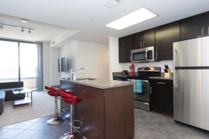 A kitchen or kitchenette at Pentagon City Luxury Apartment