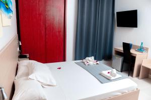 Ένα ή περισσότερα κρεβάτια σε δωμάτιο στο Hotel Cesaria