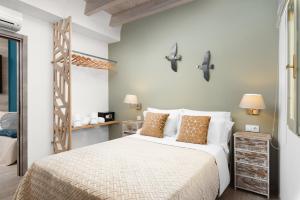 En eller flere senge i et værelse på Boutique Home -Splantzia-Roof Garden