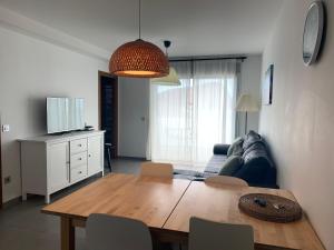 a living room with a table and a couch at Apartamento Las Terrazas in Granadilla de Abona