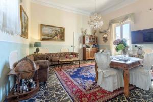 a living room with a couch and a table at Palazzo Giovanni bed and breakfast in Acireale