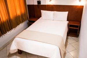 Postel nebo postele na pokoji v ubytování Hostal Vasco