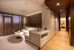 a living room with a couch and a table at The Museum Hotel Antakya in Hatay +30 photos