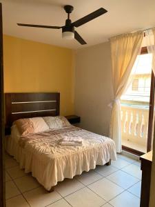 Llit o llits en una habitació de Hotel Posada San Juan