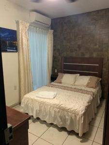 En eller flere senger på et rom på Hotel Posada San Juan