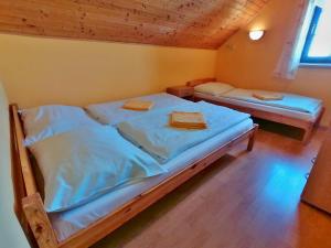 Postel nebo postele na pokoji v ubytování Chalupa Sluníčko