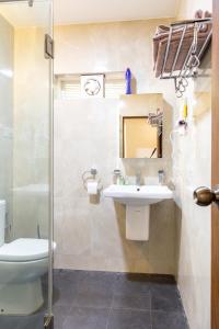 a bathroom with a sink and a toilet and a shower at Casa Arvana Near Calangute Beach in Calangute +41 photos