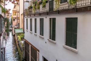 a row of windows on the side of a building at Collalto24 in Treviso