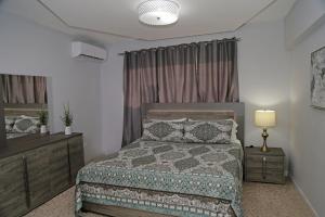 Itza-Bella Suites 객실 침대