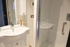 a bathroom with a sink and a shower at La Locanda dell'Olmo in Milan