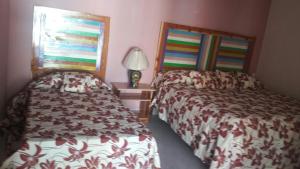 Postel nebo postele na pokoji v ubytování Villas La Quinta