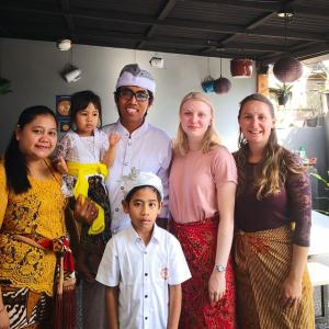a group of people posing for a picture at Dong Paloh Hostel in Munduk
