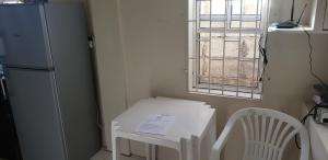 Cucina o angolo cottura di Roseau Hostel & Beach Front Property