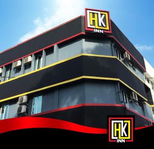 a building with the initials kym on the side of it at HK Inn Hua Kiew Inn in Miri