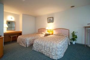 Voodi või voodid majutusasutuse Izumigo AMBIENT Izu-Kogen Condominium toas