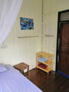 Postel nebo postele na pokoji v ubytování Orchid Guest House