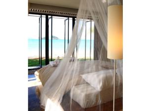 Postel nebo postele na pokoji v ubytování Seavana Koh Mak Beach Resort