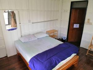 Postel nebo postele na pokoji v ubytování Orchid Guest House