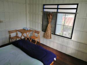 Postel nebo postele na pokoji v ubytování Orchid Guest House