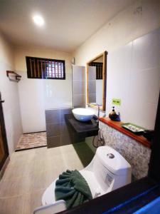 A bathroom at Coco Cape Lanta Resort - SHA Extra Plus