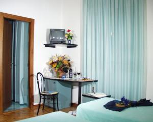 TV a/nebo společenská místnost v ubytování Hotel Paradiso