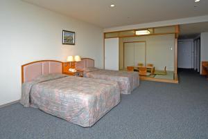 Voodi või voodid majutusasutuse Izumigo AMBIENT Izu-Kogen Condominium toas