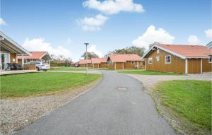 a winding road in a residential neighborhood with houses at Skærbæk Fritidscenter in Skærbæk +19 photos