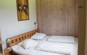 En eller flere senge i et værelse på Nice Home In Nykbing M With 3 Bedrooms And Wifi