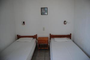 Postel nebo postele na pokoji v ubytování Sailors Apartments + 17 fotografií