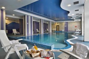 The swimming pool at or close to Rhodopi Home Hotel Chepelare - Half Board & All inclusive