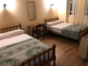 Katil atau katil-katil dalam bilik di Tulip Hotel