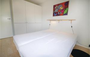 Giường trong phòng chung tại Holiday Home Ternevangen Nysted I