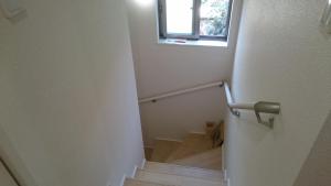 a staircase with a window and a stair case with boxes at バイキング樫本 in Hirakata +14 photos