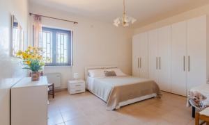 Postel nebo postele na pokoji v ubytování Villa Degli Ulivi + 37 fotografií