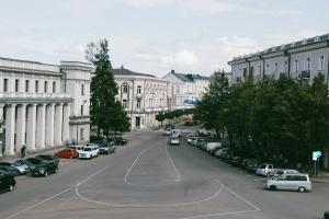 a city street with parked cars and buildings at Old Telavi in Telavi