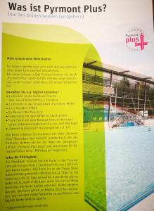 a sign for a gym with a swimming pool at Bonsai-Apartment III An der Hufeland Therme in Bad Pyrmont