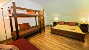 Postel nebo postele na pokoji v ubytování Apartmány Pod Čerťákem
