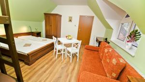 Postel nebo postele na pokoji v ubytování Apartmány Pod Čerťákem