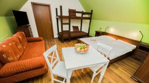 Postel nebo postele na pokoji v ubytování Apartmány Pod Čerťákem