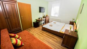 Postel nebo postele na pokoji v ubytování Apartmány Pod Čerťákem