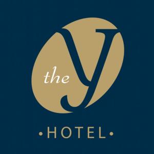 a logo for the hotel at The Y Hotel in Amman
