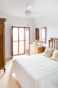 Postel nebo postele na pokoji v ubytování CASA VIDAL RELAX AL PIE DE LA SIERRA