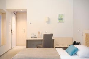 Postel nebo postele na pokoji v ubytování Art Hotel