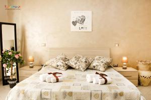 a bedroom with a bed with two pillows on it at b&b l'olimpo in Campobasso
