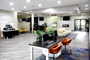 a lobby with a desk with a computer on it at Holiday Inn Houma, an IHG Hotel in Houma